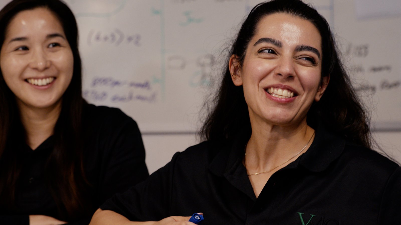 Team members smiling in the workplace