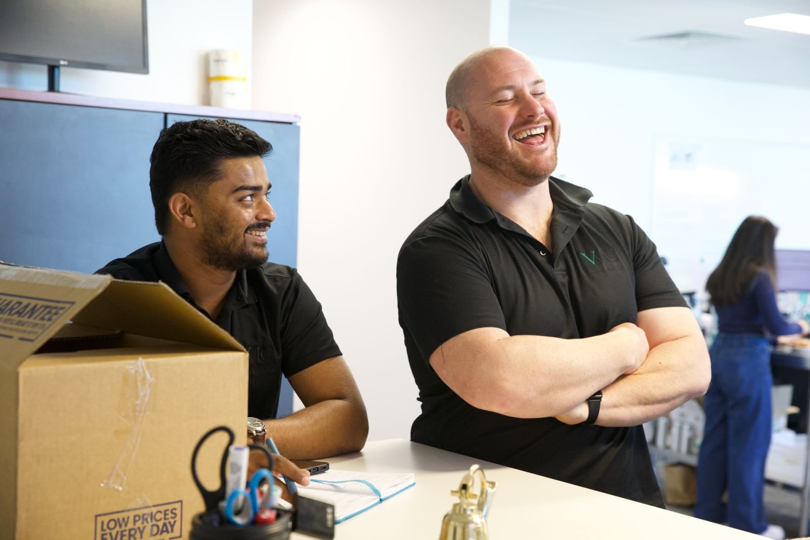 Team members smiling in the workplace